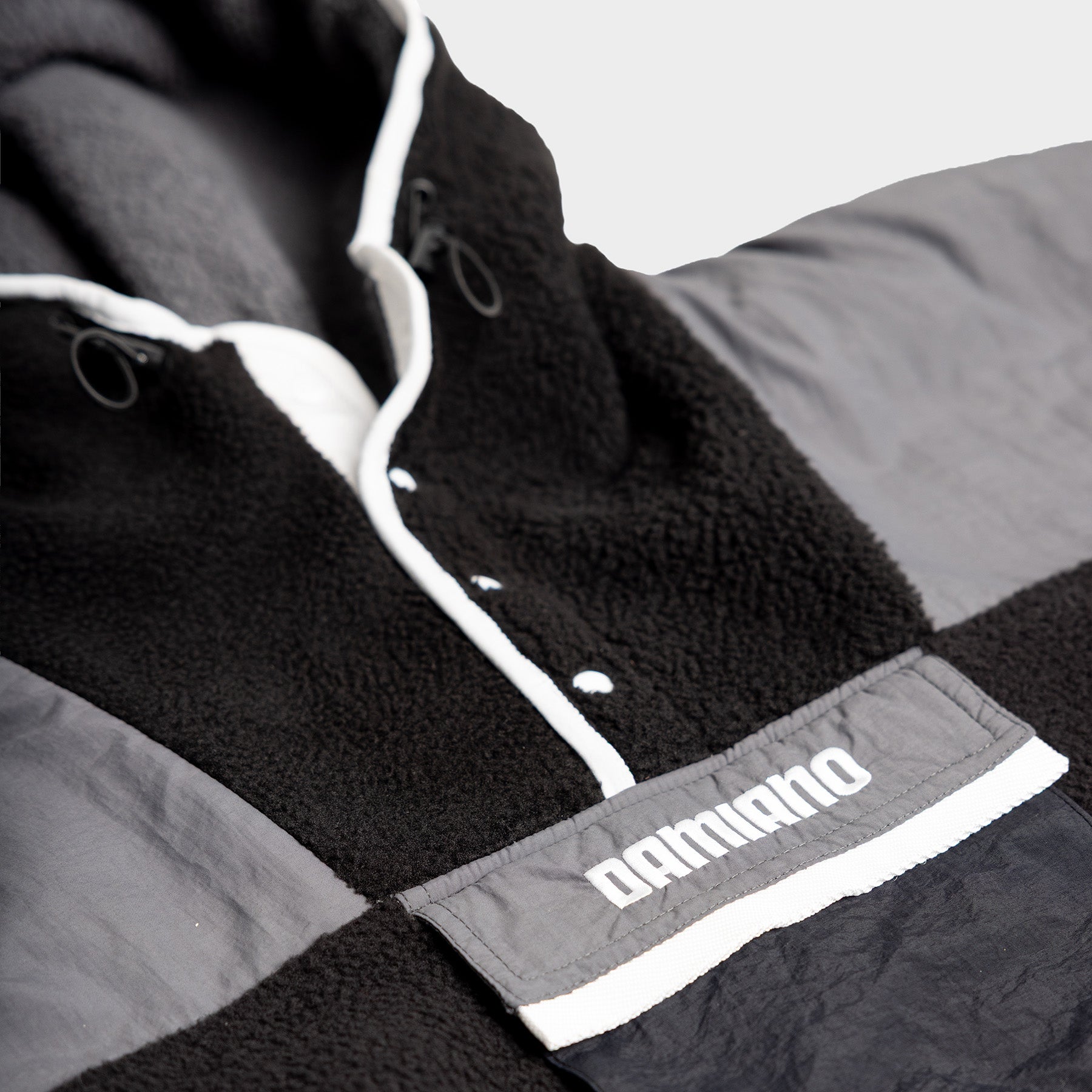 Hooded Sherpa Jacket in Black / Charcoal